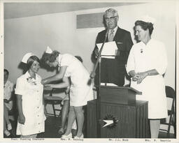 Administrator speaks at podium