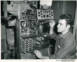 Student with an electronic machine